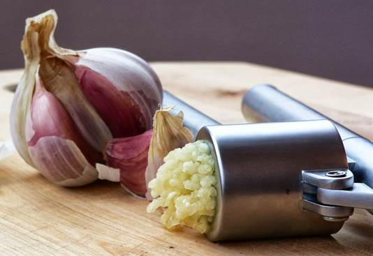 Description: Press about 4 gloves of garlic to make a table spoon of garlic juice.