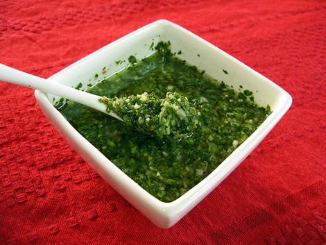 4. While the vegetables are roasting, combine the parsley and the garlic with enough oil 