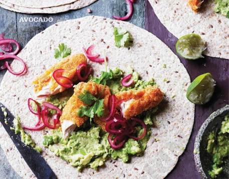 Smashed avocado with crispy chicken, pickled onions & tortillas