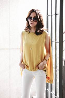 Description: The split of the sleeve is a new variation for classic white pants.