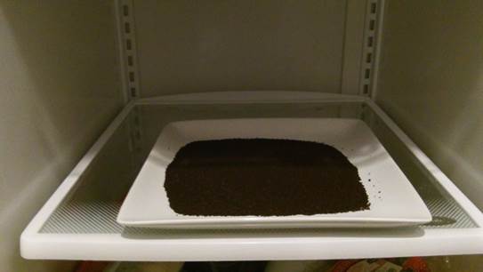 Put a bowl of coffee grounds in a refrigerator and let it absorb all the unwanted smells.
