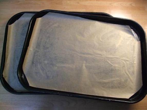 Description:  Line 2 baking trays with greaseproof paper.