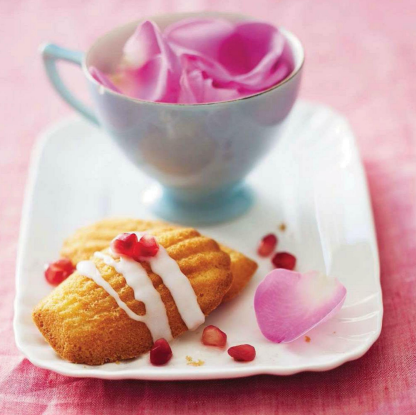Description: Rose water Madeleines with pomegranate icing