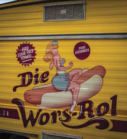 Description: Die Wors-Rol’s mascot Betsie is emblazoned across the canary-yellow trailer